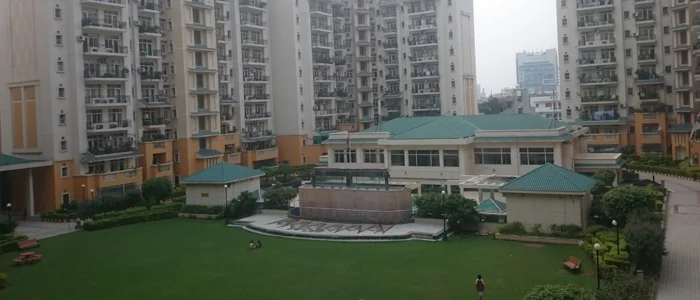Showing Flats Balcony View with its Front Road and Garden